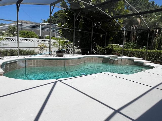 702 Palenci Ct, Winter Springs, FL 32708 - view of pool featuring fence, a patio, a pool with connected hot tub, and a lanai