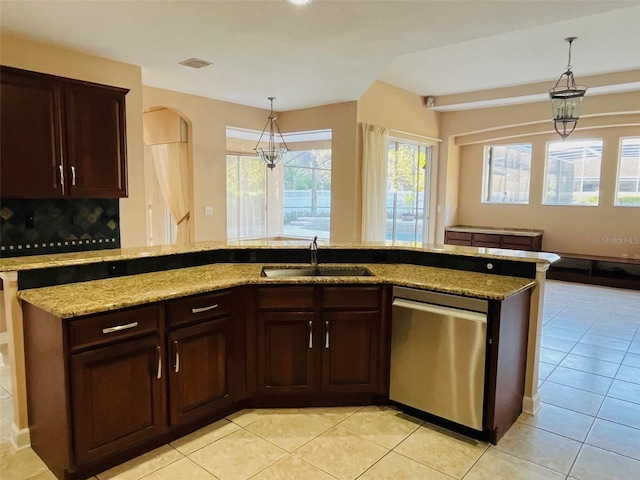 702 Palenci Ct, Winter Springs, FL 32708 - kitchen with stainless steel dishwasher, pendant lighting, a sink, and light stone counters