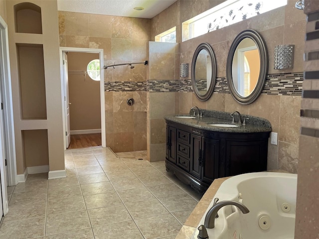702 Palenci Ct, Winter Springs, FL 32708 - bathroom with a sink, tile patterned floors, walk in shower, and tile walls