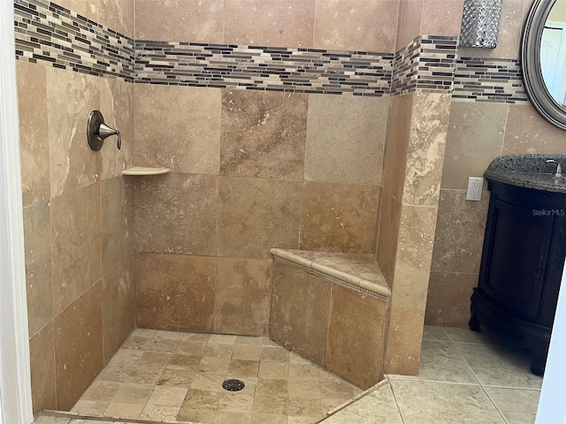 702 Palenci Ct, Winter Springs, FL 32708 - bathroom with a tile shower, vanity, and tile walls