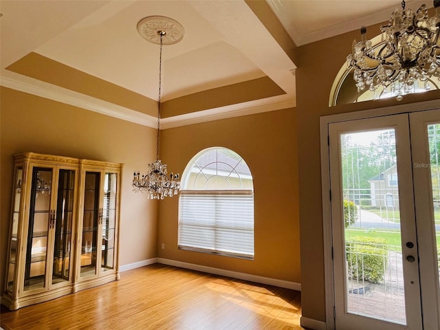 702 Palenci Ct, Winter Springs, FL 32708 - interior space featuring an inviting chandelier, light wood-style floors, and a healthy amount of sunlight