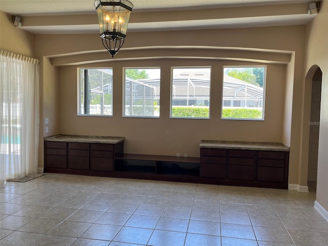 702 Palenci Ct, Winter Springs, FL 32708 - spare room featuring arched walkways and light tile patterned floors