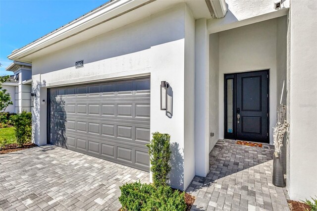 15865 Key Biscayne Ln, Loxahatchee, FL 33470 - garage with decorative driveway