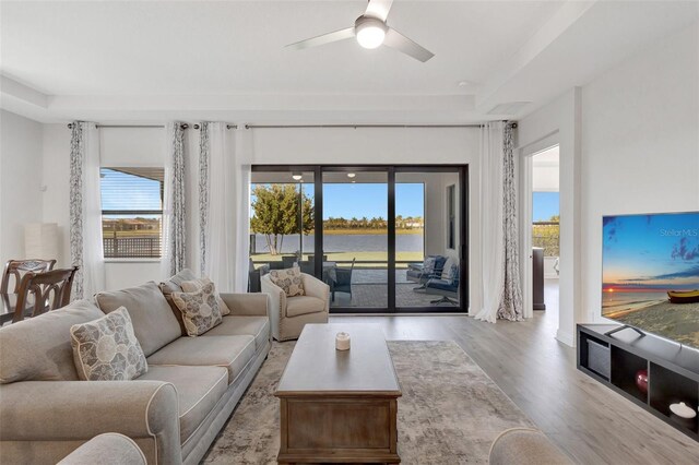 15865 Key Biscayne Ln, Loxahatchee, FL 33470 - living area with wood finished floors, healthy amount of natural light, and ceiling fan