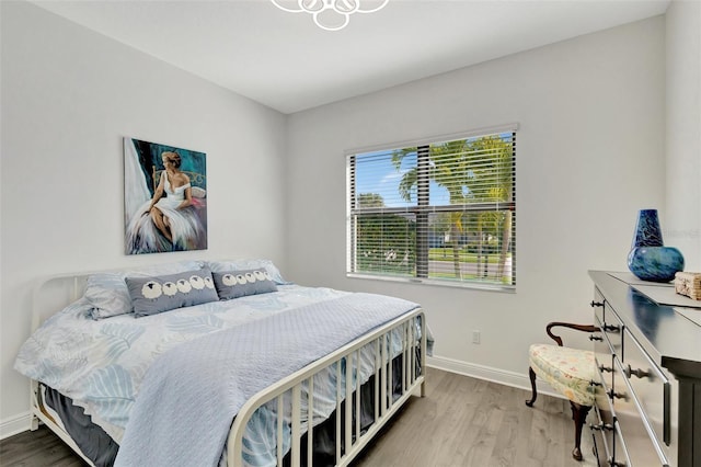15865 Key Biscayne Ln, Loxahatchee, FL 33470 - bedroom with baseboards and wood finished floors