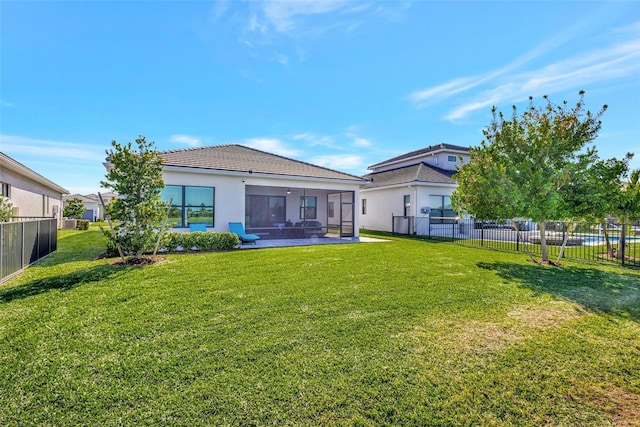 15865 Key Biscayne Ln, Loxahatchee, FL 33470 - rear view of property with a sunroom, stucco siding, and a tile roof