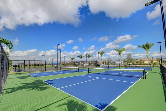 15865 Key Biscayne Ln, Loxahatchee, FL 33470 - view of tennis court with fence and community basketball court