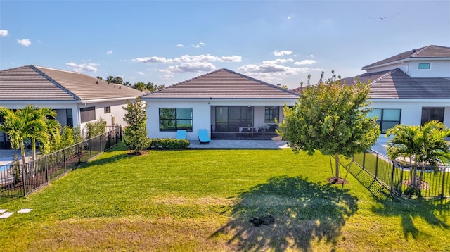 15865 Key Biscayne Ln, Loxahatchee, FL 33470 - back of property featuring a tiled roof, a patio area, and stucco siding