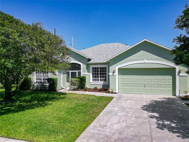 1157 Valley Creek Run, Winter Park, FL 32792 - ranch-style home with concrete driveway, stucco siding, a front lawn, and a garage