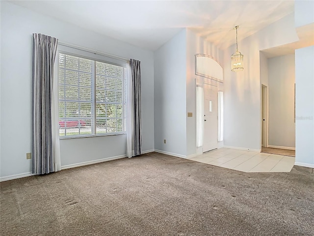 1157 Valley Creek Run, Winter Park, FL 32792 - unfurnished room featuring baseboards, carpet flooring, and lofted ceiling