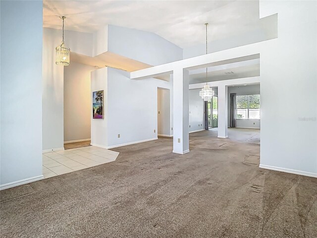 1157 Valley Creek Run, Winter Park, FL 32792 - unfurnished living room featuring high vaulted ceiling, baseboards, carpet, and a notable chandelier