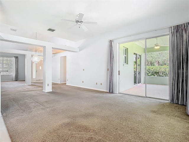 1157 Valley Creek Run, Winter Park, FL 32792 - unfurnished living room with visible vents, carpet, and ceiling fan with notable chandelier