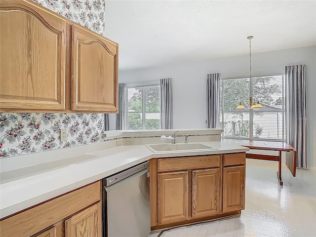 1157 Valley Creek Run, Winter Park, FL 32792 - kitchen featuring stainless steel dishwasher, a peninsula, light countertops, a sink, and decorative light fixtures