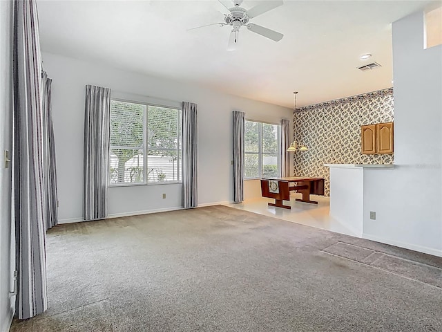 1157 Valley Creek Run, Winter Park, FL 32792 - carpeted living room featuring ceiling fan, visible vents, baseboards, an accent wall, and wallpapered walls