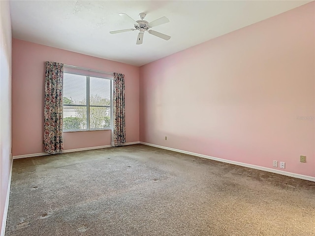 1157 Valley Creek Run, Winter Park, FL 32792 - spare room featuring baseboards, carpet, and a ceiling fan