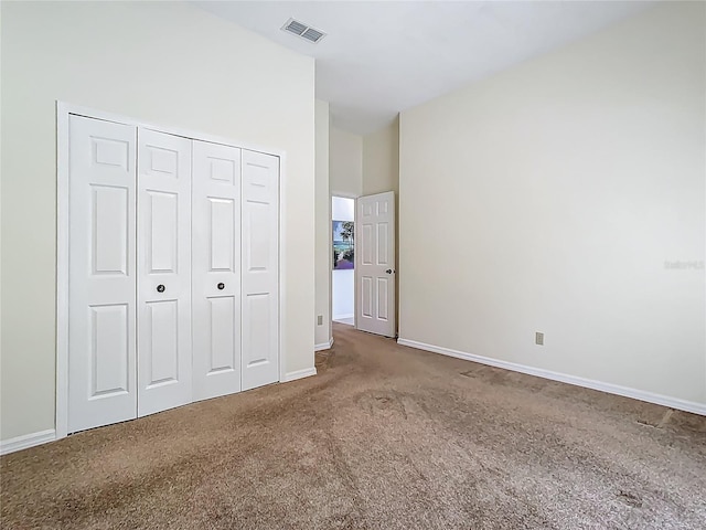 1157 Valley Creek Run, Winter Park, FL 32792 - unfurnished bedroom featuring carpet floors, baseboards, a closet, and visible vents