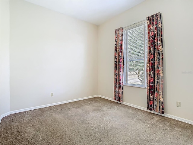 1157 Valley Creek Run, Winter Park, FL 32792 - spare room featuring baseboards and carpet