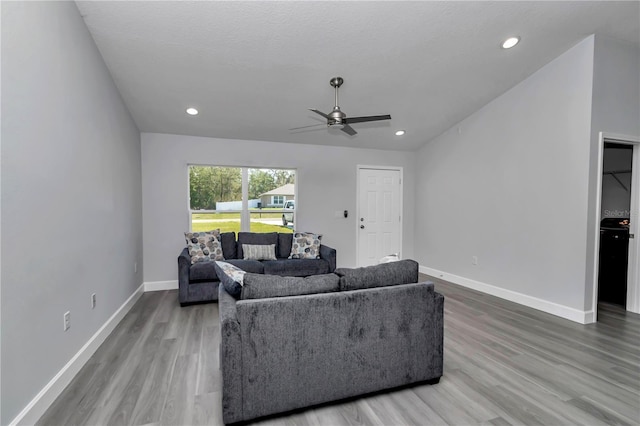 17468 SW 36th Ter, Ocala, FL 34473 - living room with wood finished floors, ceiling fan, baseboards, and recessed lighting