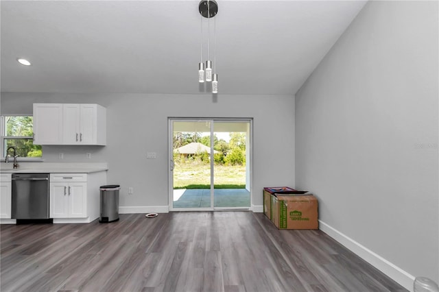 17468 SW 36th Ter, Ocala, FL 34473 - unfurnished dining area with a wealth of natural light, dark wood-style flooring, and baseboards