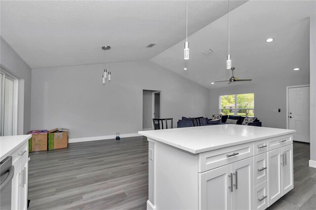 17468 SW 36th Ter, Ocala, FL 34473 - kitchen featuring white cabinets, baseboards, open floor plan, light wood finished floors, and vaulted ceiling