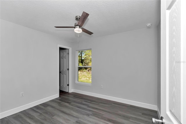 17468 SW 36th Ter, Ocala, FL 34473 - unfurnished room featuring baseboards, a textured ceiling, ceiling fan, and dark wood finished floors