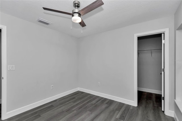 17468 SW 36th Ter, Ocala, FL 34473 - unfurnished bedroom featuring ceiling fan, a closet, visible vents, dark wood-style flooring, and baseboards