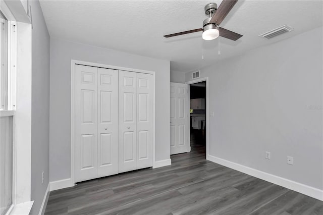 17468 SW 36th Ter, Ocala, FL 34473 - unfurnished bedroom featuring a closet, visible vents, baseboards, and wood finished floors
