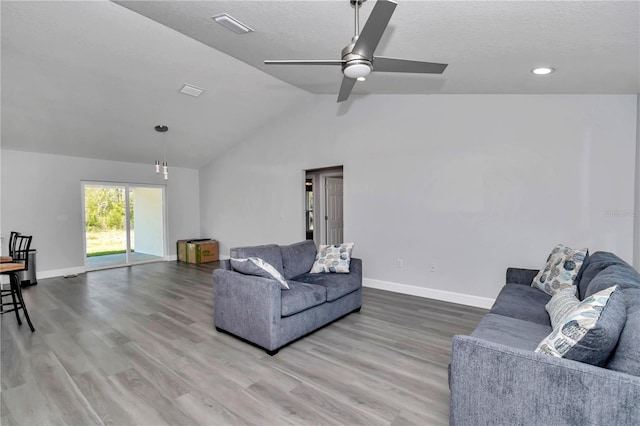 17468 SW 36th Ter, Ocala, FL 34473 - living area with baseboards, wood finished floors, a ceiling fan, and lofted ceiling