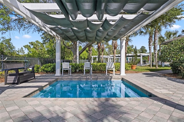 view of swimming pool featuring a pool, fence, a patio, and a pergola