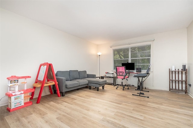 office area with wood finished floors and baseboards