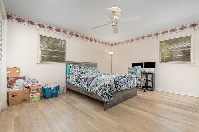 bedroom with wood finished floors and a ceiling fan