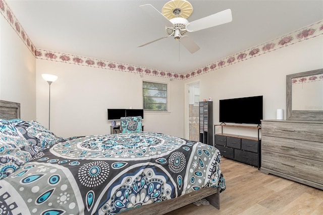 bedroom with light wood-style flooring and a ceiling fan