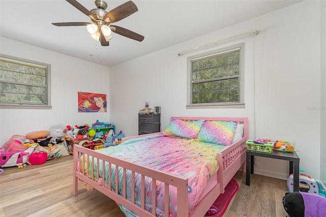 bedroom featuring wood finished floors and ceiling fan