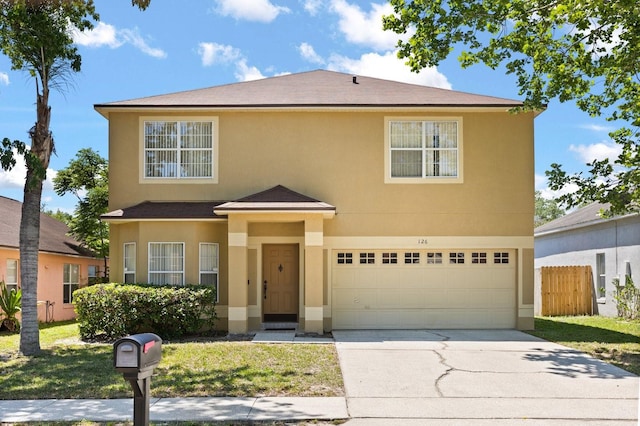 126 Knights Hollow Dr, Apopka, FL 32712 - traditional home featuring a front yard, a garage, fence, stucco siding, and driveway