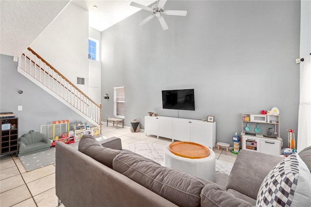 1415 Sherbourne St, Winter Garden, FL 34787 - living area with a ceiling fan, high vaulted ceiling, light tile patterned flooring, and stairs