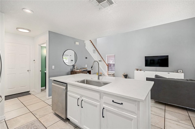 1415 Sherbourne St, Winter Garden, FL 34787 - kitchen with open floor plan, a textured ceiling, visible vents, dishwasher, and a sink