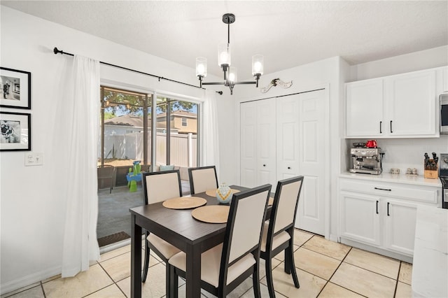 1415 Sherbourne St, Winter Garden, FL 34787 - dining area featuring a bar, a textured ceiling, an inviting chandelier, and light tile patterned floors