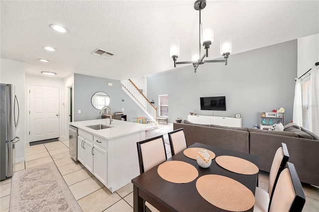 1415 Sherbourne St, Winter Garden, FL 34787 - kitchen featuring white cabinetry, a textured ceiling, visible vents, stainless steel appliances, and a sink