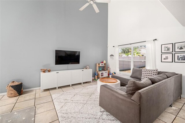 1415 Sherbourne St, Winter Garden, FL 34787 - living room with light tile patterned floors, ceiling fan, a towering ceiling, and baseboards