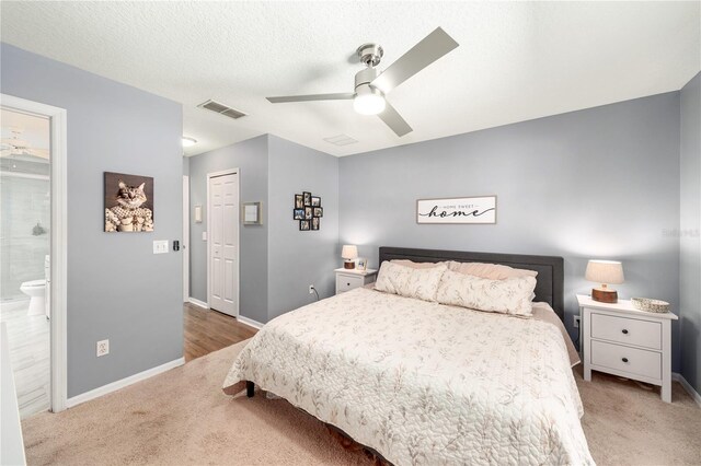 1415 Sherbourne St, Winter Garden, FL 34787 - carpeted bedroom with ceiling fan, visible vents, baseboards, and ensuite bathroom