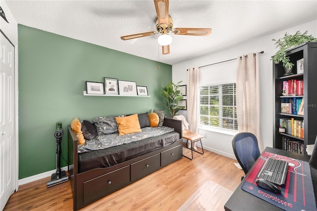 1415 Sherbourne St, Winter Garden, FL 34787 - office featuring a textured ceiling, baseboards, a ceiling fan, and wood finished floors
