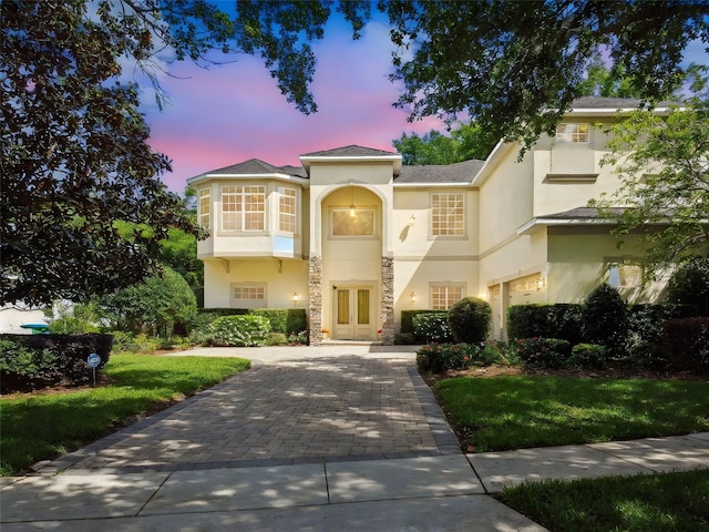 755 Cranes Ct, Maitland, FL 32751 - mediterranean / spanish home featuring stucco siding, french doors, decorative driveway, and a front yard