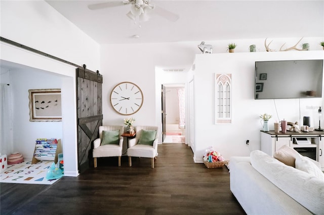 4217 Avanti Cir, New Port Richey, FL 34655 - living room with visible vents, a ceiling fan, a barn door, and wood finished floors