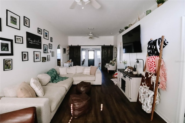 4217 Avanti Cir, New Port Richey, FL 34655 - living room featuring arched walkways, dark wood finished floors, and a ceiling fan