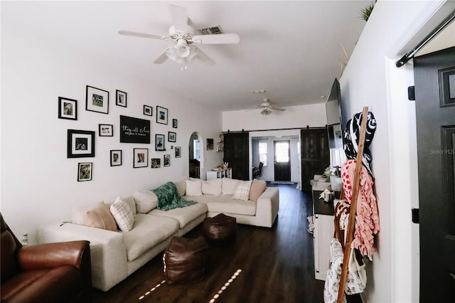 4217 Avanti Cir, New Port Richey, FL 34655 - living area featuring visible vents, ceiling fan, arched walkways, and dark wood-style floors