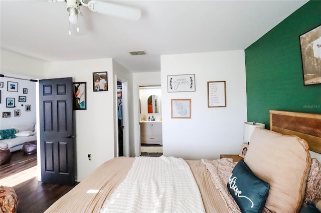 4217 Avanti Cir, New Port Richey, FL 34655 - bedroom with visible vents, a ceiling fan, ensuite bathroom, and wood finished floors