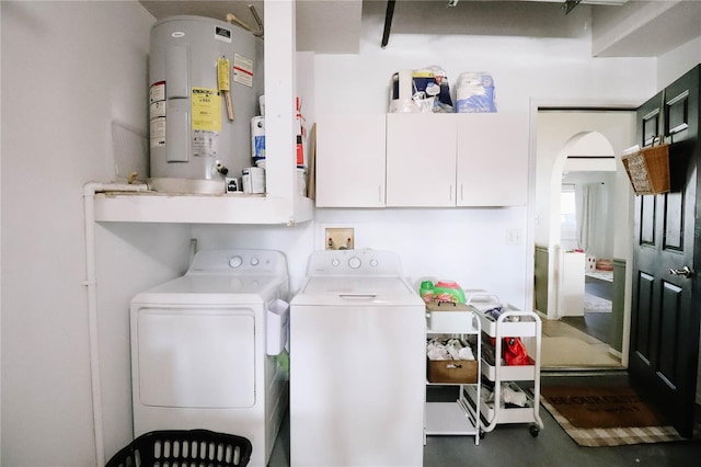 4217 Avanti Cir, New Port Richey, FL 34655 - laundry area with arched walkways, laundry area, washing machine and clothes dryer, and water heater