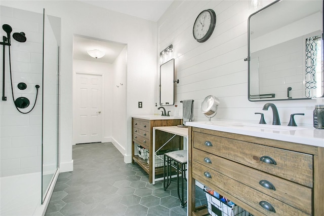 full bathroom featuring a walk in shower, vanity, and baseboards