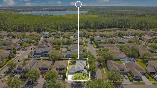 aerial view with a wooded view and a residential view