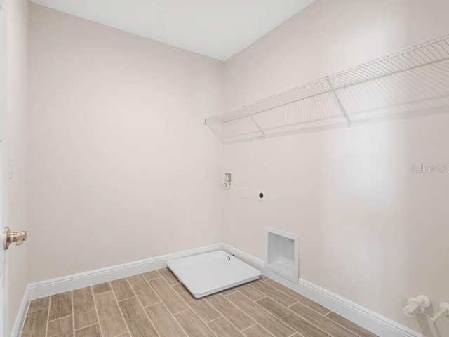 16195 Point Rock Dr, Winter Garden, FL 34787 - washroom featuring hookup for an electric dryer, visible vents, laundry area, and wood tiled floor